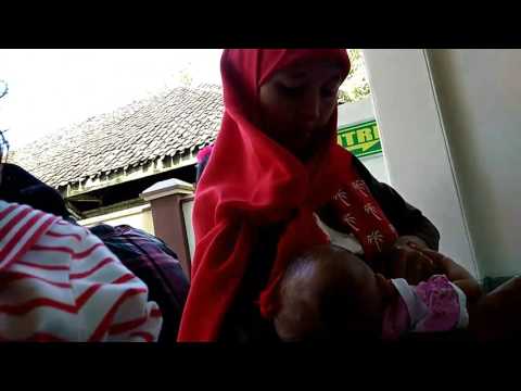 Red hijab breastfeeding