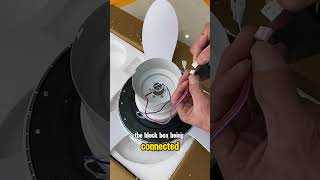 Installing a ceiling fan with LED lights for an apartment.
