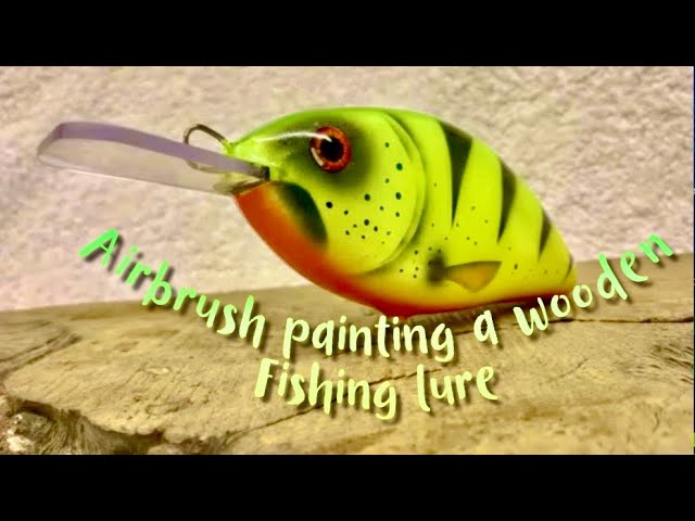 Airbrush painting a wooden fishing lure 