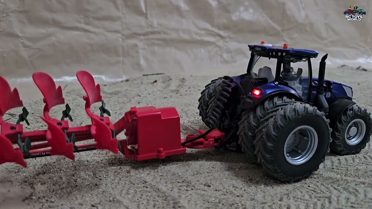 Siku Control 32 New Holland T7 Plowing Soil with Rotary Plow 