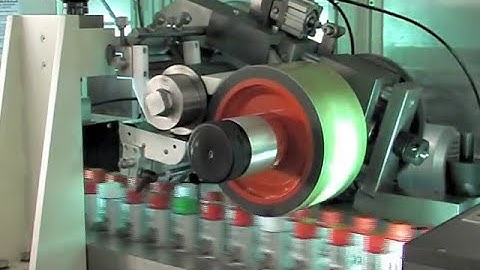 Automatic high speed cap printing by offset