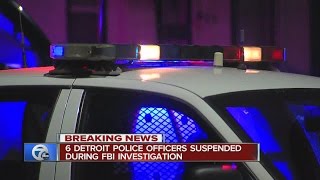 DPD officers suspended amid federal investigation