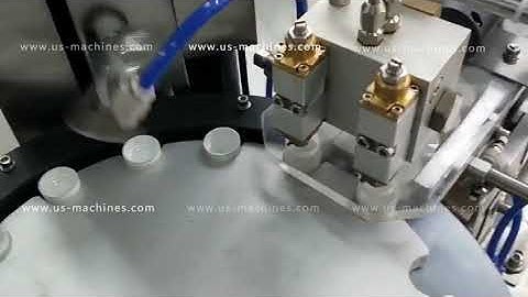 Automatic cap glue filling wad lining assembling machine cap gluing wading machine