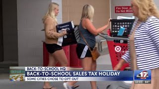 Volunteers hand out free school supplies at Rock the Community back-to-school event