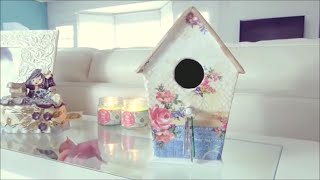 Materials you need to make this beautiful bird house: - Cardbooard - Hot glue - White Glue - White paint - Masking tape - Decorative 