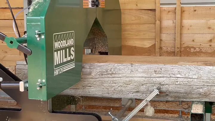 out in the board room sawing a cedar pole