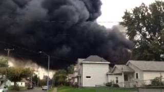 Firefighters battle large warehouse fire in Lima