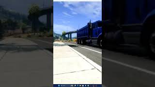 Old Freightliner Dump Truck Entering The Highway.