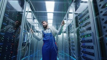 Technician Walking In Server Room Stock Video