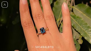 Career Overview A Token of Your Unbroken Bonds: This Emerald-cut Solitaire London Blue Topaz Infinity Twist Ring