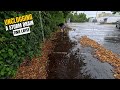 #075-1 - Time Lapse - Unclogging a storm drain on a parking space after rain in Germany