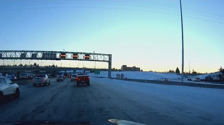 Ice-covered roads as crews work to clear snow, abandoned cars