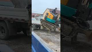 Skilled Operator Mini Excavator Loading Itself Like A Boss