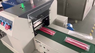 Flow wrap packing machine for several pcs of candles packing with auto feeder