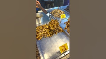 Fried worms, grasshoppers in oil