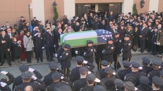 Thousands honor fallen NYPD officer; A bridge stuck in time