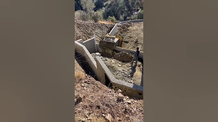 Backfilling the retaining wall in a tight space