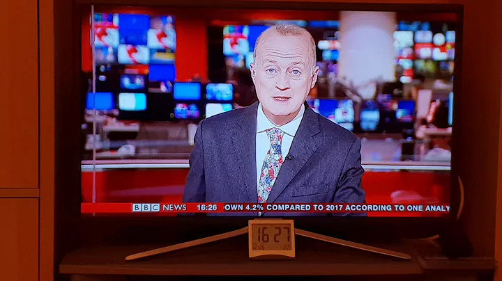 BBC news reader Shaun Key having a sneezing fit