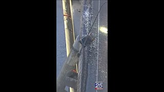 Crash leaves pickup truck dangling over wall on Boston’s Zakim Bridge