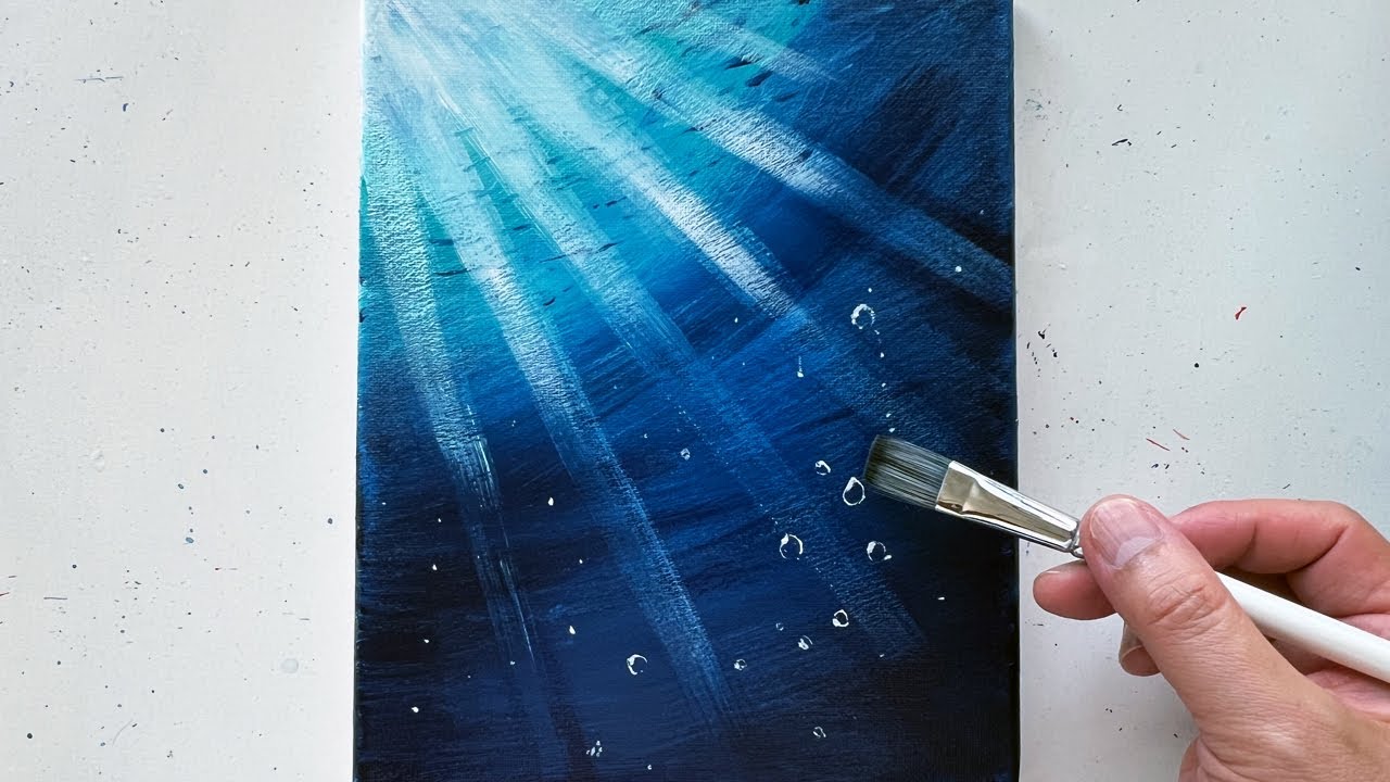 I tried to paint a scene of light shining down on the sea with