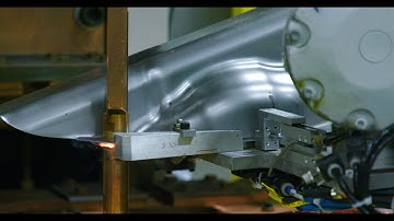 Robot Assisted Fuel Tank Projection Welding System