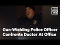 Gun-Wielding Police Officer Confronts Doctor At His Office | NowThis