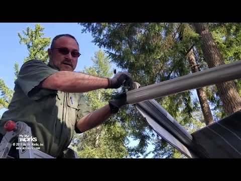 torn-rv-awning-with-a-failed-motor-gets-removed-and-replaced