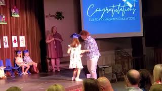 Saylor's Kindergarten Graduation..Receiving diploma, her memory book, and medal. May 2022
