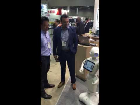 Yasser and Kats are  interacting with a Pepper Robot – The robot was used in C2M®