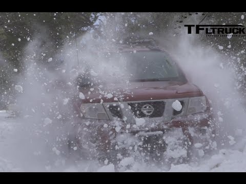 2014-nissan-frontier-pro-4x-vs-ford-raptor-slow-motion-snow-bash