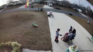 Girl in full face helmet rides electric dirt bike with training wheel and crashes into circuit box