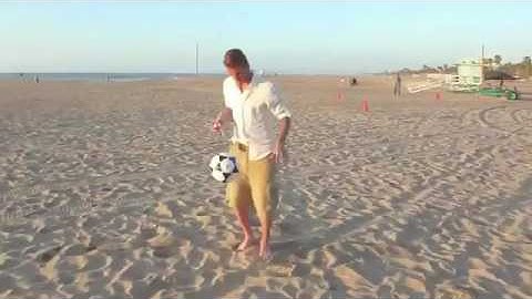David Beckham shooting at trash cans at the beach