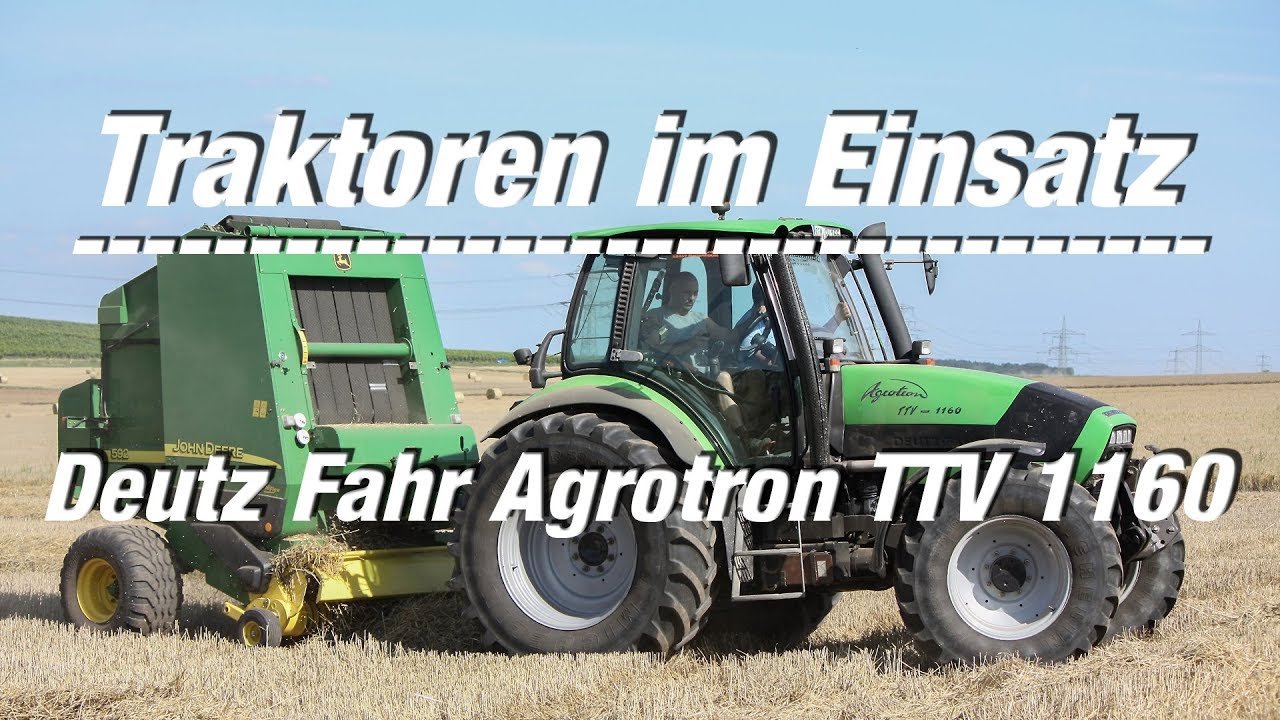 Traktoren im Einsatz: Deutz Fahr Agrotron TTV 1160 mit John Deere 592 Rundballenpresse