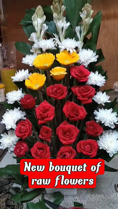 A bouquet of raw flowers. chrysanthemum red rose yellow fringe