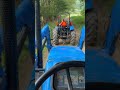 Big New Holland broken again towing it home.