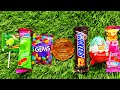 some lots of colorful rainbow lollipop candy / unpacking chocolate eat