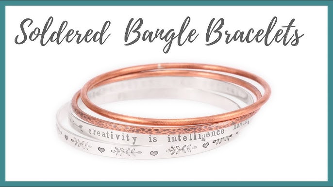 The Secret to Fitting a Small Bangle Over a Wide Hand – Between