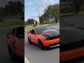 Crazy sounding mustangs leaving cars and coffee