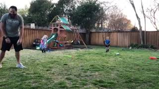 Guy plays catch with son and boy gets hit with ball in a sensitive area