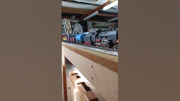 Marklin analogue 3003/2-6-0 with tender leaving yard