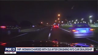 Dash-cam video shows car fly off interstate, crash into car dealership