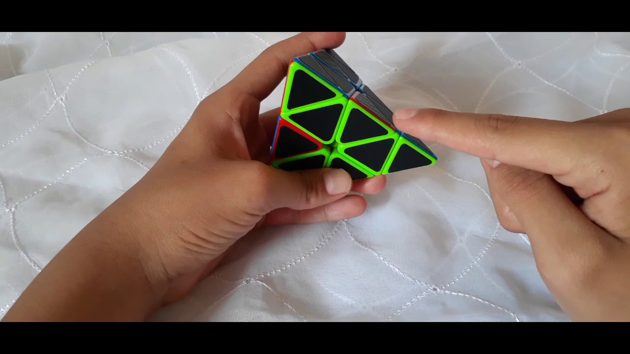 Resolver cubo pyraminx paso 2 aristas en cara superior primer