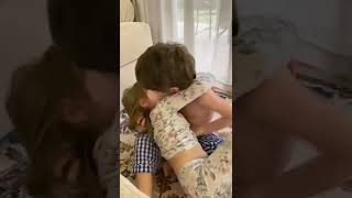 Brother consoles sister after crying from a boo-boo.
