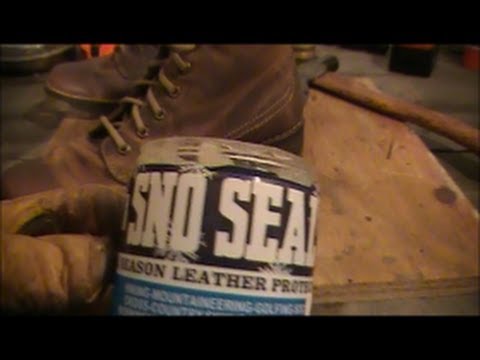 One of our crew applying Sno-Seal to - Universal Footwear