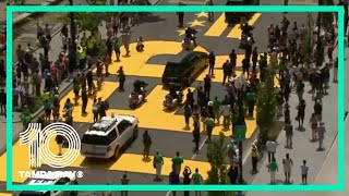 John Lewis' procession makes its way through Black Lives Matter Plaza