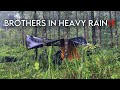 Two brothers in heavy raincamping in heavy rain