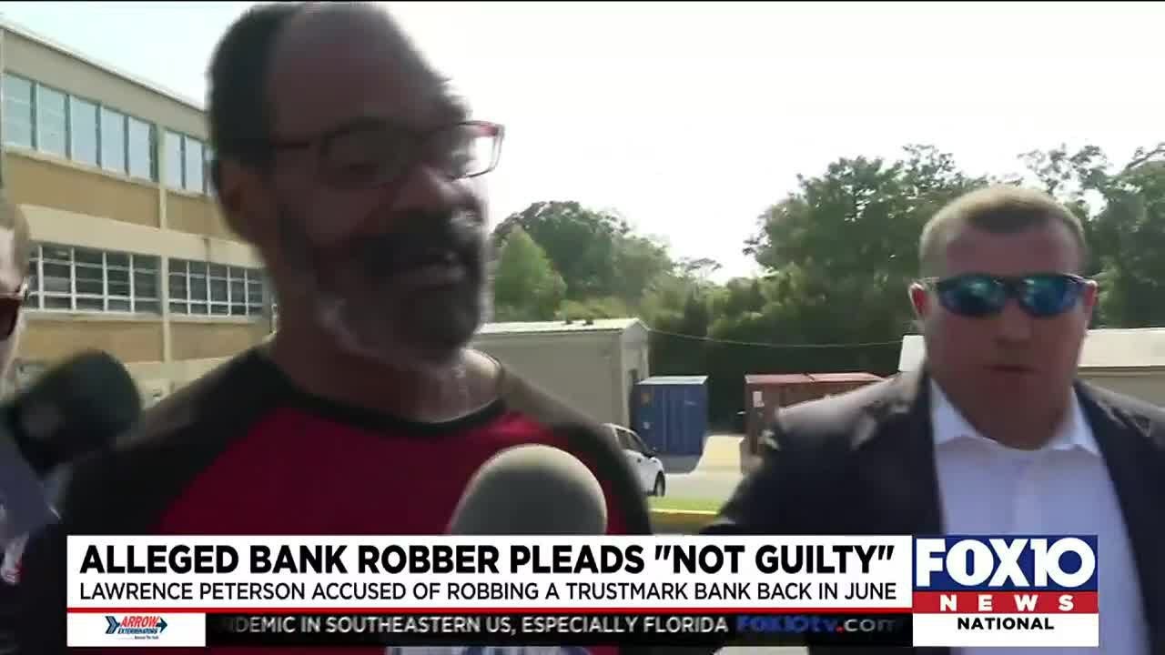 Alleged bank robber pleads not guilty - YouTube