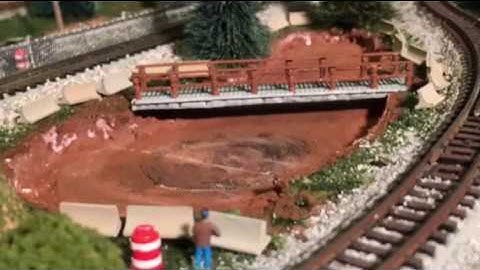 Model RR N Scale Update #32 - Scratch built a footbridge and concrete barriers plus added Dollar Tr