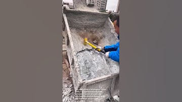 Demolition Work: Breaking Up Concrete with a Sledgehammer
