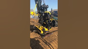 Hyundai excavator with Engcon EC-Oil hydraulic hitch picking up tiltrotator.